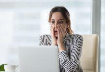 Your business reputation is no longer yours to control A professional female appearing shocked by what she is seeing online