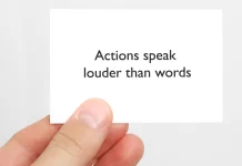 Stakeholders judge behaviour, not messaging A white card printed with the words 'Actions speak louder than words'