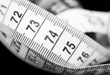 Measuring what matters: KPIs for strategic key account management A close up image of a measuring tape