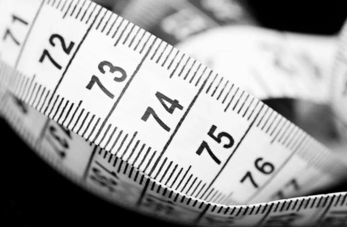 Measuring A close up image of a measuring tape