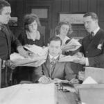 Frazzled-Looking-man-signing-papers