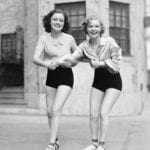 Two-girls-roller-skating-in-tandem