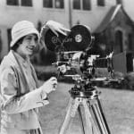 1920s-woman-filming-with-a-vintage-camera-on-a-tripod