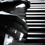 Fingers on Piano Keyboard